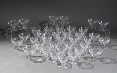 a lot of wine glasses that are sitting on a table