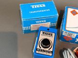 two boxes of electrical equipment sitting on a table
