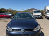 the volkswagen golf is parked in a parking lot with other vehicles