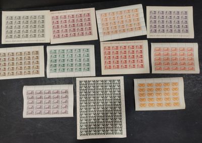a bunch of stamps with different designs on them on a table