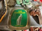 a tray with a picture of an elephant on it on a table