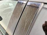 a dog sticking its head out of the window of a car