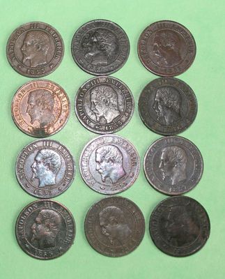 a lot of coins that are on a green surface