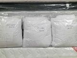 a stack of mattresses that are on display in a store