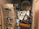 many boxes stacked on top of each other in a small room