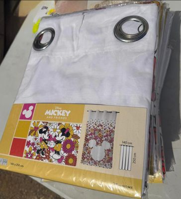 a stack of mickey mouse napkins sitting on a table