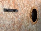 a picture of a wall with a mirror and a door handle