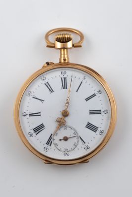 a gold pocket watch with roman numerals on it