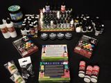 many different types of paint and glues on a table