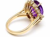 a close up of a ring with an amethorate and diamonds
