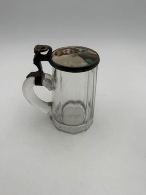 a glass mug with a handle and a handle on it