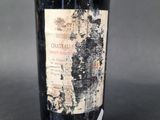 a bottle of wine that is sitting on a table