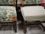 four chairs with floral upholstered cushions are sitting on a tile floor
