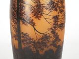 a vase that has a picture of a tree on it