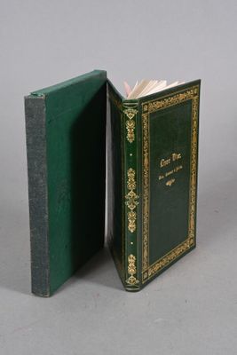 a green book opened to reveal a green cover