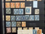 a picture of a collection of stamps on display in a glass case