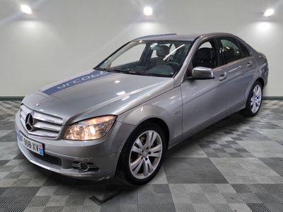 a picture of a mercedes c - class in a showroom