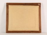 an old wooden frame with a beige canvas on a white surface