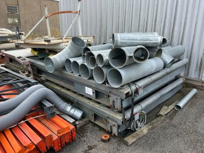 a pile of pipes sitting on top of a pallet