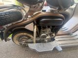 a motorcycle that is parked on the side of the street