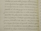 a close up of an open book with writing on it