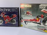 two boxed lego technic sets on the table