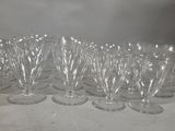 a lot of empty wine glasses sitting on a table
