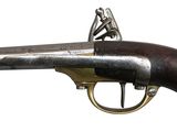an old gun that is on display on a white background