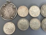 six different types of silver coins are arranged in a row