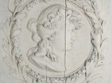 a picture of a carving of a woman on a wall