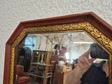 a man that is taking a picture of himself in a mirror