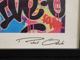 framed photograph of a colorful graffiti art piece with a name on it