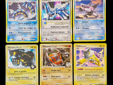 Plusieurs cartes Pokémon sont représentées sur un fond noir