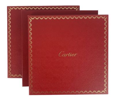 a set of three red cards with gold trimming