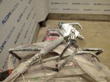 a picture of a wrench sitting on top of a pile of tools