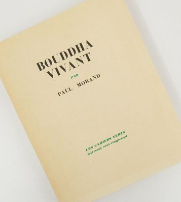 a close up of a book on a white surface