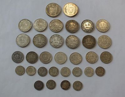 a close up of a pile of coins on a white surface