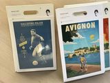 two books on the table with a picture of a man playing soccer