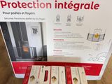 three boxes of protection integrate sit on the floor next to each other
