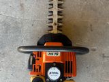 a close up of a chainsaw on a concrete surface