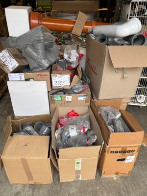 many boxes of assorted items sitting on the floor