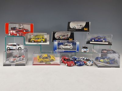 many different models of cars in a display case