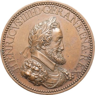 une vieille pièce de bronze représentant le portrait d'un homme barbu