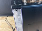 an image of a coffee maker on a wooden table
