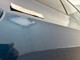 a sticker on the hood of a car that has a sticker on it