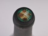 a close up of a bottle of wine on a table