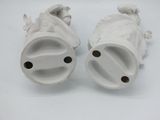pair of white porcelain fish figurines on a white background