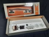 a box with a toy train set in it