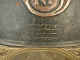 a close up of a metal pot on a table