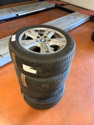 a tire that is sitting on the floor next to some other tires
